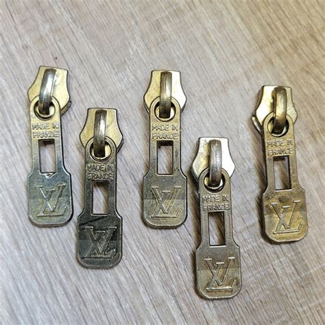 vintage Louis Vuitton zipper pulls